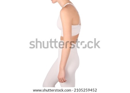A woman with an impaired posture, scoliosis defect and an ideal bearing. Girl with bad posture on white background. Royalty-Free Stock Photo #2105259452