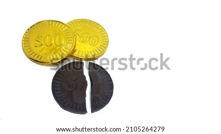 Gold chocolate coins isolated over white background. Snack from indonesia