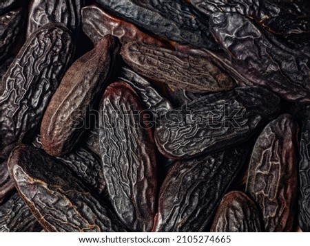 good food background from spices. macro photo of heap tonka beans in detail large root beans Royalty-Free Stock Photo #2105274665