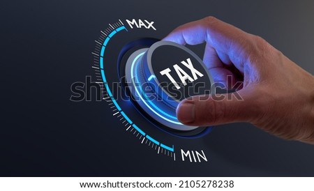 Tax reduction and deduction for businesses and individuals. Concept with hand turning knob to low taxation rate. Return form, exemptions, incentives. Royalty-Free Stock Photo #2105278238