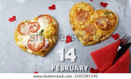 the image of a pizza in the form of a heart. preparing for a Valentine's Day dinner. intimate dinner for lovers.