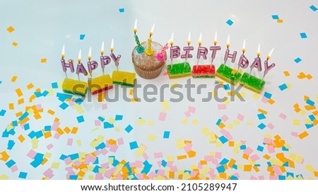 Happy birthday decorations for any age. Top view cupcake with candles burning festive