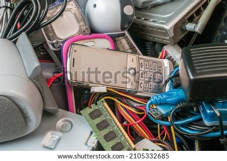 e-Waste including smartphones, memory, cables Royalty-Free Stock Photo #2105332685