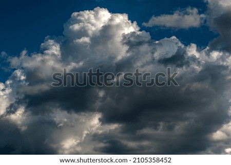 blue sky with storm textured clouds	
