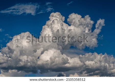 blue sky with storm textured clouds	

