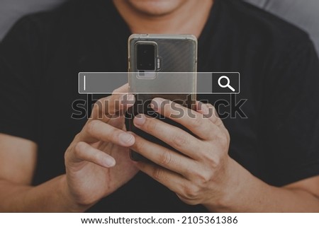 Man using phone searching browsing internet data Information with search bar icon. Networking concept
