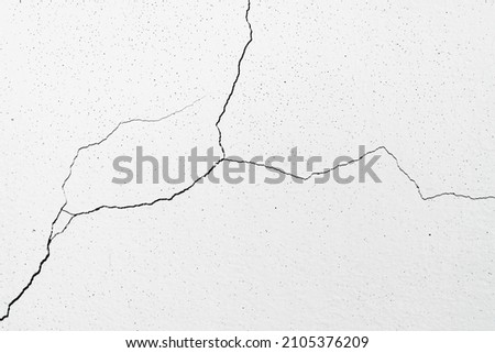 Image for use as a background, diagonally cracked white wall, which is still a small line, not very large. Which the renovation is still easy. Royalty-Free Stock Photo #2105376209