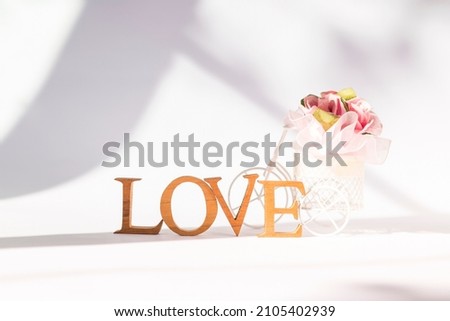 Valentine background idea, love and romance concept, love wooden font with flower cart