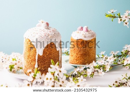 Easter cake with glace icing and decoration. Postcard with Easter bread. Christian traditions. Copy space. White background