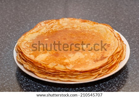 Pancakes on a white plate