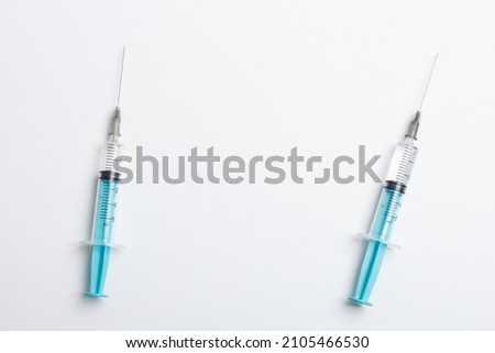 Medical syringe on a white background. A syringe for injection. The concept of health and beauty Royalty-Free Stock Photo #2105466530