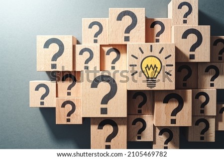 Many questions and finding solution. Top view of many wood cubes with icons. 
 Royalty-Free Stock Photo #2105469782