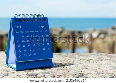 Blue August 2022 calendar on blurred background of blue ocean. 2022 New Year Concept Royalty-Free Stock Photo #2105480564