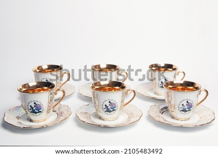 porcelain cups with gold decoration