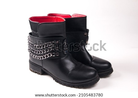 demi-season women's boots on a white background. Women's shoes with a chain