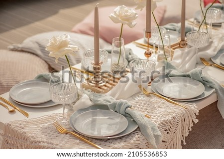 Festive picnic on the roof of the house with beautiful decorations Royalty-Free Stock Photo #2105536853