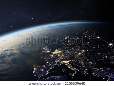 Planet Earth from the space at night. Europe with city lights in UK, Germany, France, Spain, Italy, Portugal, Austria, Greece, Turkey and other countries. Elements of this image furnished by NASA. Royalty-Free Stock Photo #2105539640