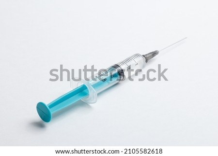 Medical syringe on a white background. A syringe for injection. The concept of health and beauty Royalty-Free Stock Photo #2105582618