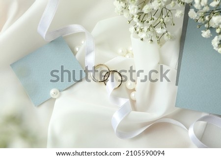 Concept of wedding accessories with wedding rings, close up Royalty-Free Stock Photo #2105590094