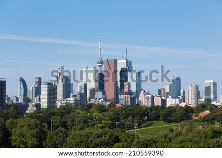 A view of Toronto from the East during the day, with logos removed from buildings