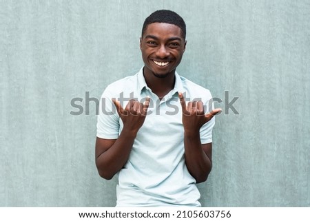 Portrait happy African American smiling with hang loose hand sign