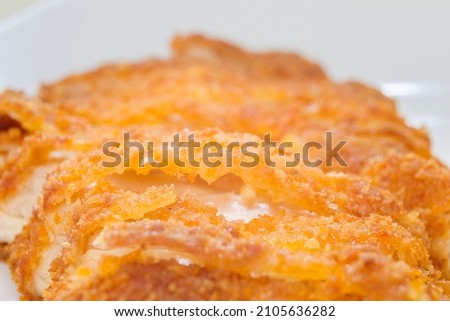 Crispy chicken katsu in close-up photo with golden color