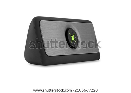 Portable black speaker for listening to music via Bluetooth close-up isolated on white background. Mini speaker for music with lime green element