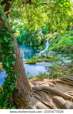 Waterfalls at Krka river, Croatia. Part of the Skradinski Buk waterfall. Famous place in nature park - beautiful tourist destination in Croatia. Fresh green nature, summer weather.
