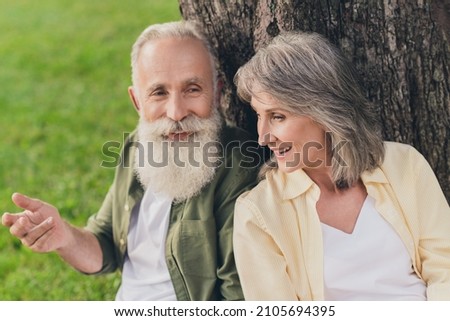 Photo of happy old cheerful grey haired retired pensioner happy people sit tree enjoy vacation nature green spring outside outdoors in park Royalty-Free Stock Photo #2105694395