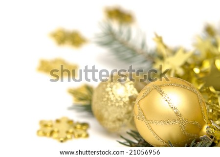 Golden  bulbs and spruce twigs on a white