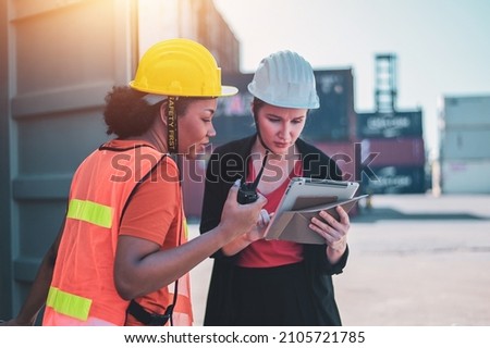 Team worker American women Work in an international shipping yard area Export and import delivery service with containers Royalty-Free Stock Photo #2105721785