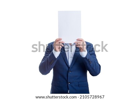 Anonymous businessman covering face with a blank paper sheet, like a mask to hide emotions. Incognito person hidden, isolated on white background. Introvert people concept Royalty-Free Stock Photo #2105728967