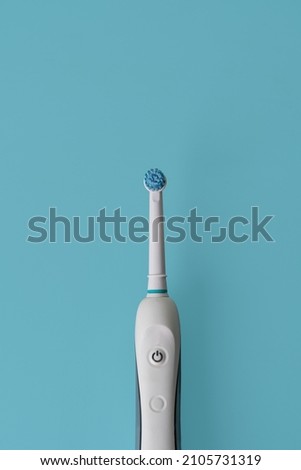 Electric tooth brush isolated background. Modern rechargeable sonic or electric toothbrush. Concept of professional oral care and healthy teeth. 