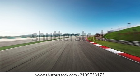 Curvy motion blurred race track. Royalty-Free Stock Photo #2105733173