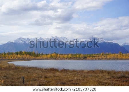 Mountain lake in the taiga and Kodar ridge in Trans Baikal territory Royalty-Free Stock Photo #2105737520