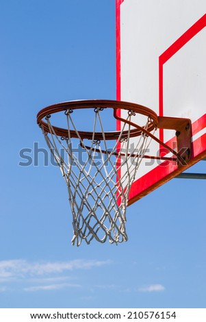 The park basketball backboard and net.