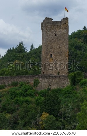 tower of old castle ruin Oberburg surrounded by green forest, Manderscheid, Germany