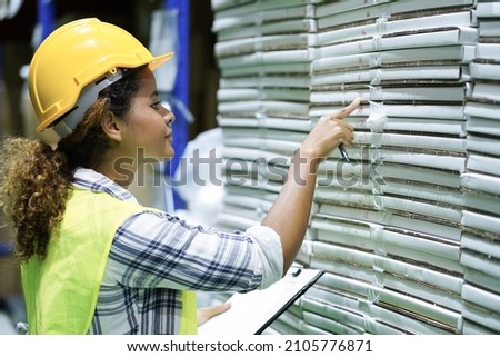 Worker inventory inspect staff checking and inspect package box with checklist in warehouse factory storage products shipment distributor logistic supply for counting and management Royalty-Free Stock Photo #2105776871
