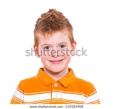 Close up portrait of a cute red-haired boy against white background