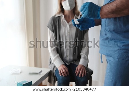 Doctor examining with antigen test at the patient's home