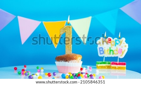 Beautiful birthday greetings to one year old child on a blue background, postcard with the number 1 years old happy birthday copy space. Festive background with decorations for a small child