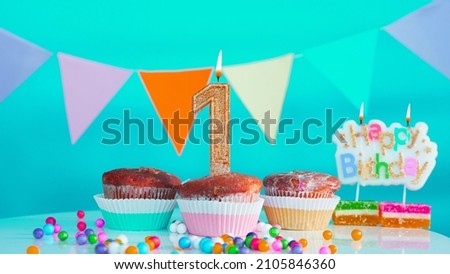 Beautiful congratulations on the birthday of one year old child on a blue background, a card with the number 1 years happy birthday. Background with festive decorations for a small child