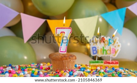 Beautiful card, Happy birthday greetings to a seven year old child, card with the number 7 years happy birthday. Background with festive decorations for a small child
