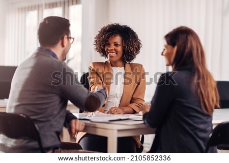 Business people shaking hands after meeting Royalty-Free Stock Photo #2105852336