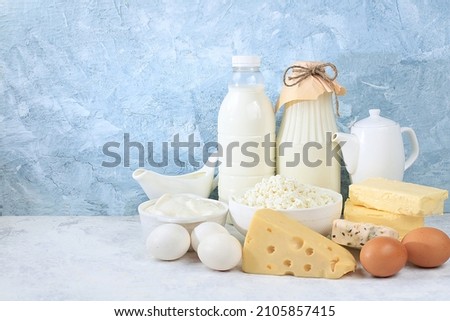 Assorted fresh dairy products, healthy breakfast with ingredients, natural nutrition concept, maintaining healthy intestinal microflora, diet food, rustic table, selective approach