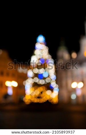 the art picture of defocus christmas tree and a golden bokeh abstract  background