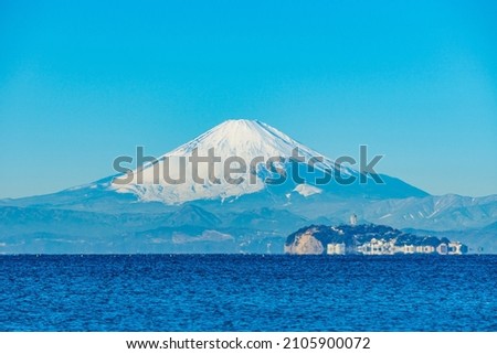 Mt. Fuji and Enoshima from Zushi Beach in Kanagawa Prefecture, Japan Royalty-Free Stock Photo #2105900072