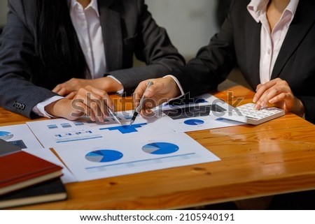 Business team present. Business man hands hold documents with financial statistic stock photo, discussion, and analysis report data the charts and graphs. Finance concept