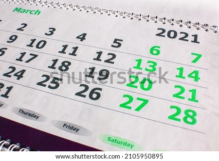 Calendar for March 2021. Wall-mounted paper calendar, top view.
