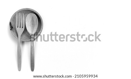 Black and white, Wooden kitchenware that gives a classic and minimalist impression. Food and drink concept. Food Photography. Flat Lay Wooden spoon and fork on the table. Space for text. Copy space.